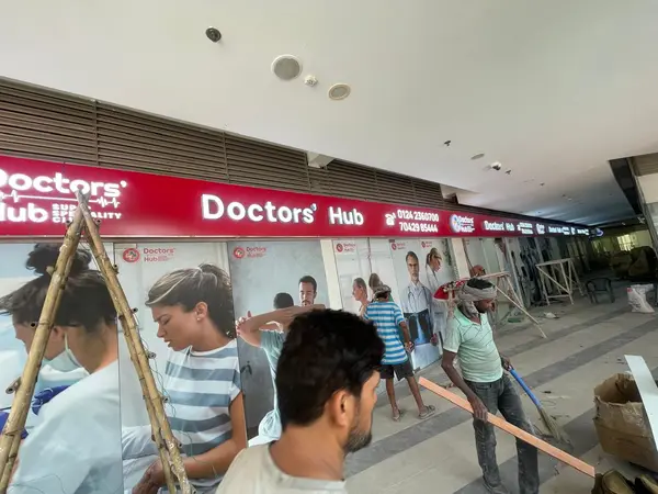 Doctors' Hub Super Specialty Clinic sign by Brandmaxx